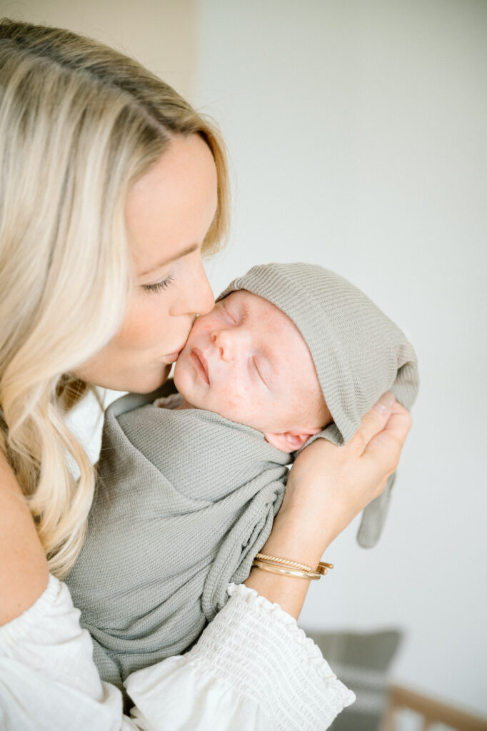 Cozy newborn wrapped in neutral swaddle