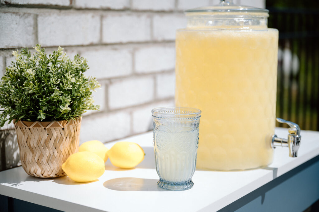 Lemon-themed first birthday party setup with soft blues and white in Louisville KY