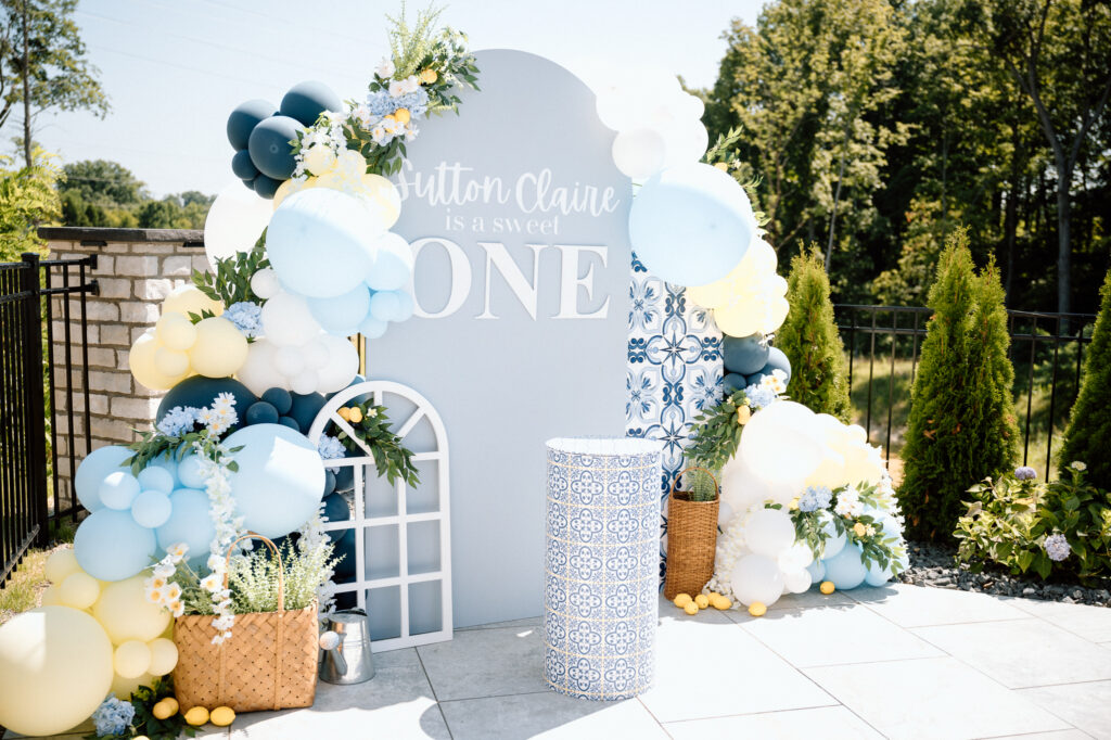 Lemon-themed first birthday party setup with soft blues and white in Louisville KY