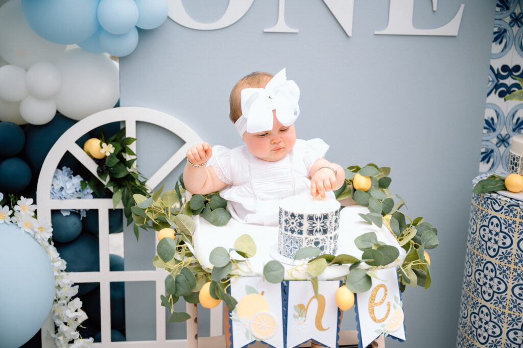 Candid family moment laughing with baby girl at outdoor lemon-themed shoot