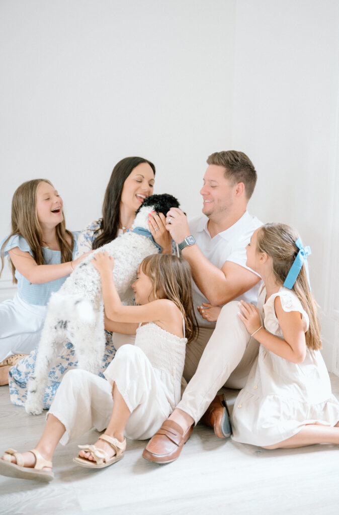Candid family portrait with dog in Lexington KY photography studio
