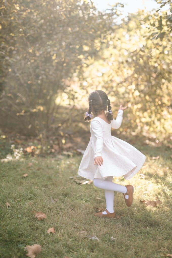 Family laughing together during fall mini session at golden hour
