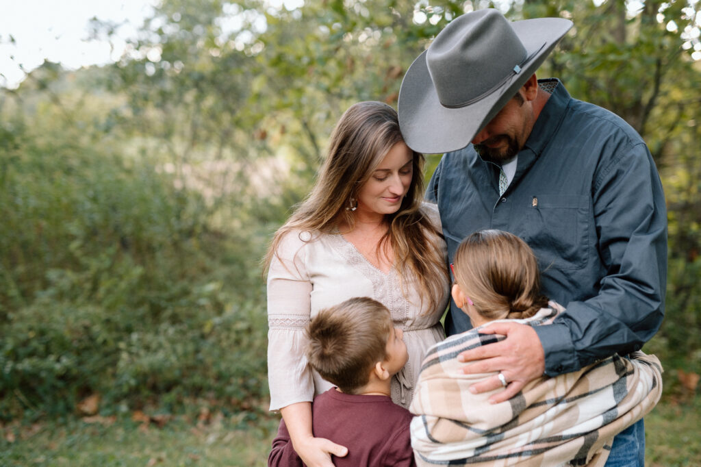 Photographer taking candid fall family photos in Lexington outdoor session