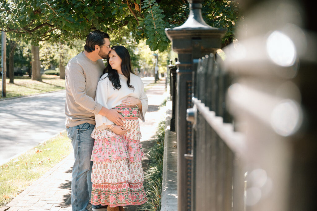 Expecting parents walking together during maternity session at Gratz Park Lexington