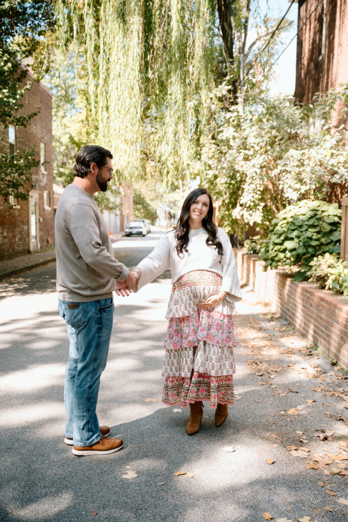 Expecting parents walking together during maternity session at Gratz Park Lexington