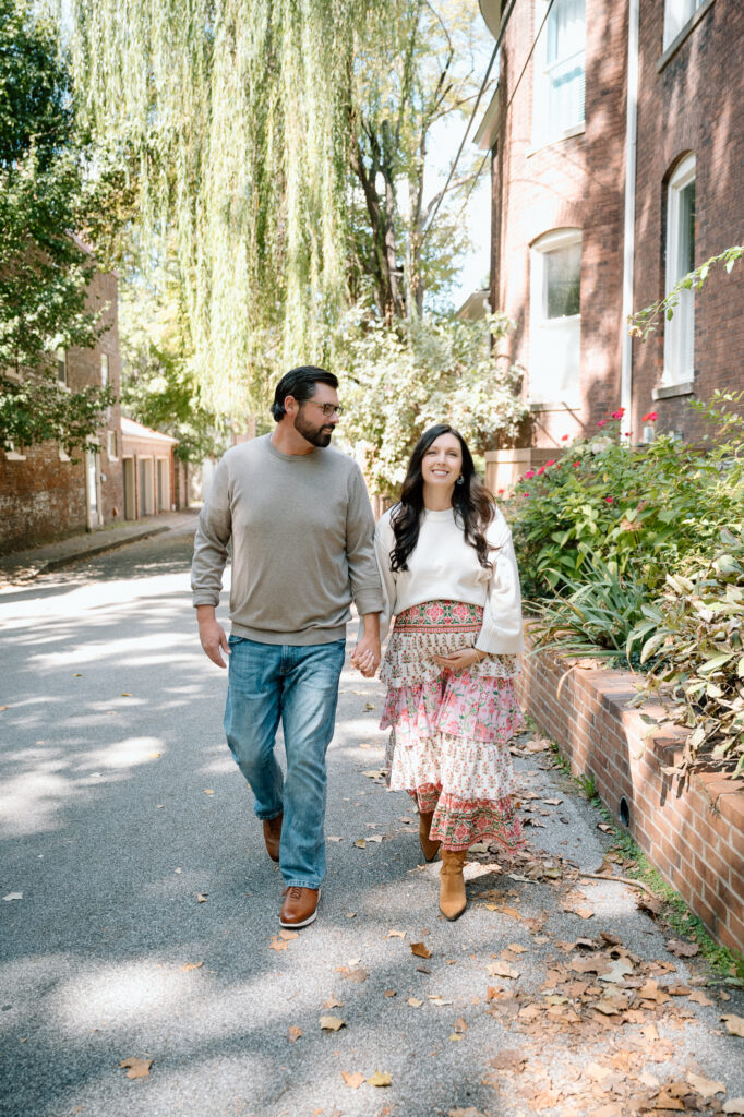 Expecting parents walking together during maternity session at Gratz Park Lexington