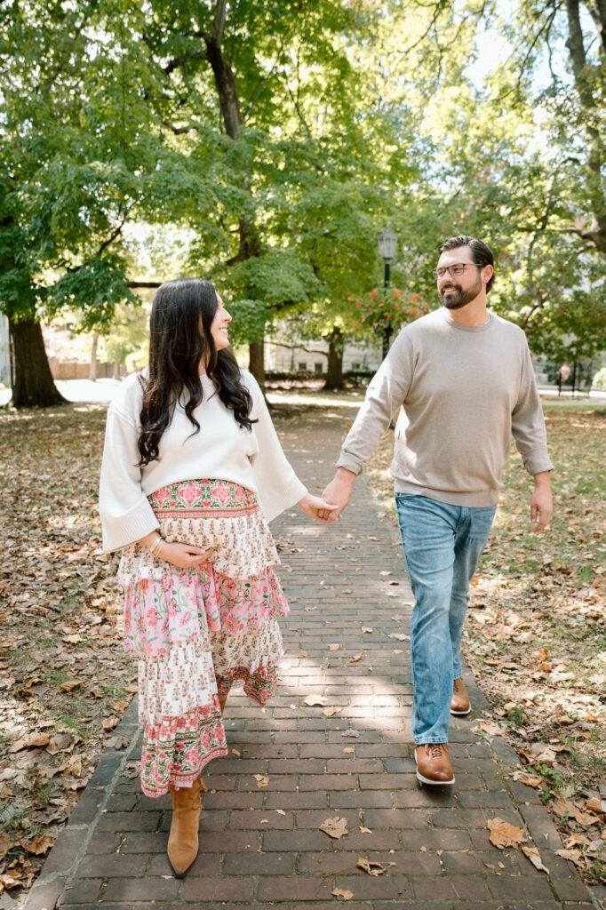 Expecting parents walking together during maternity session at Gratz Park Lexington