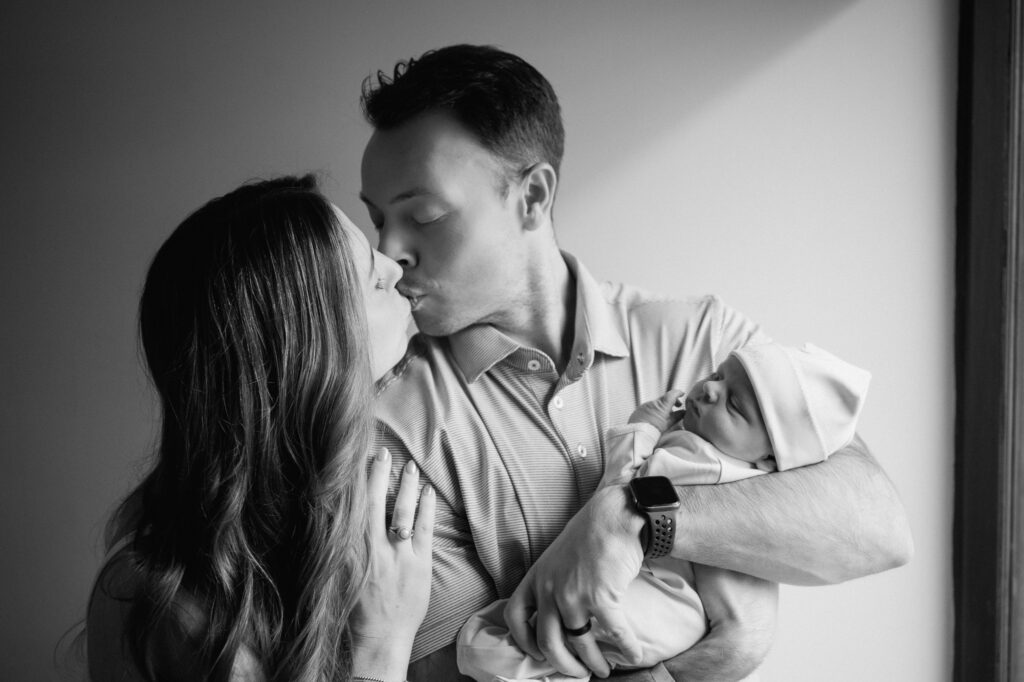 Louisville parents holding newborn during fresh 48 hospital session