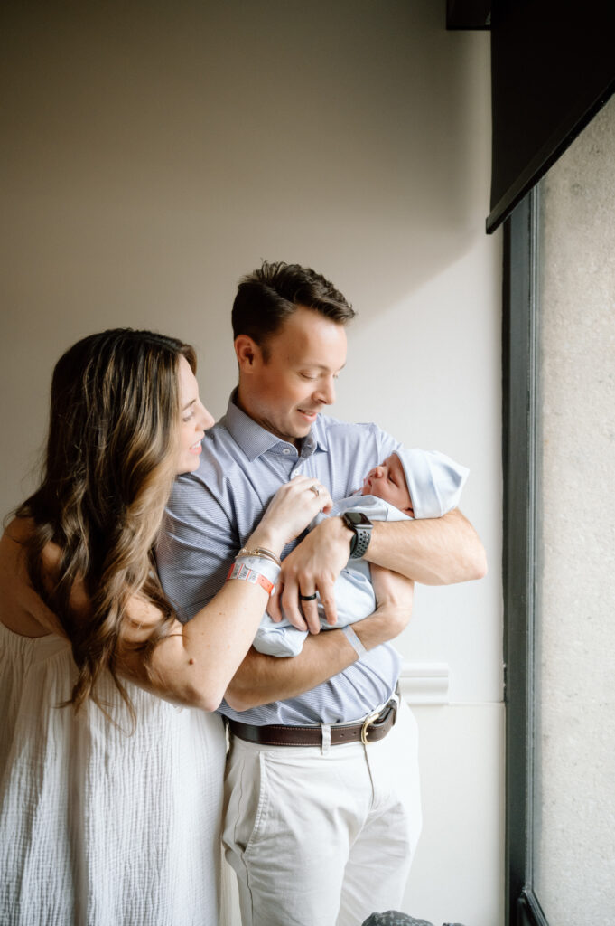 Louisville parents holding newborn during fresh 48 hospital session